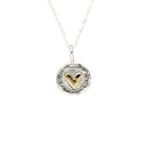 Sterling silver pendant with a gold plated heart