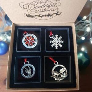 Christmas decorations gift box containing four individual pewter decorations